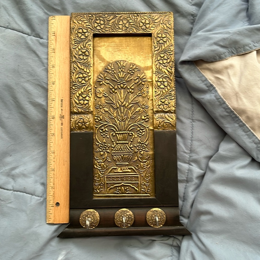 wooden and golden necklace holder